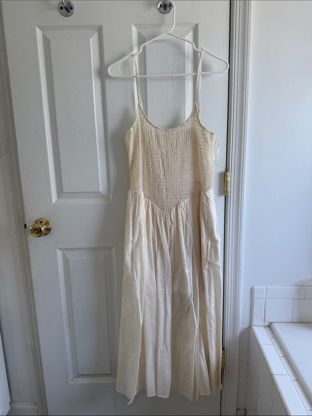 Smocked top drop waist cream dress